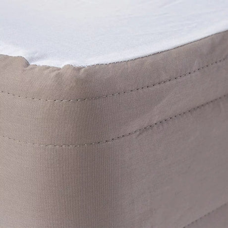 Padded valance in oat color, designed for long single beds, adding elegance and concealing the bed base beautifully.