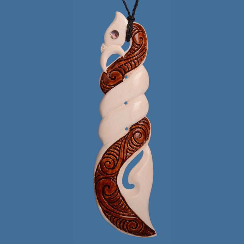 XL Bone Manaia Twist Pendant featuring intricate Maori design, made from beef bone with a paua shell accent.