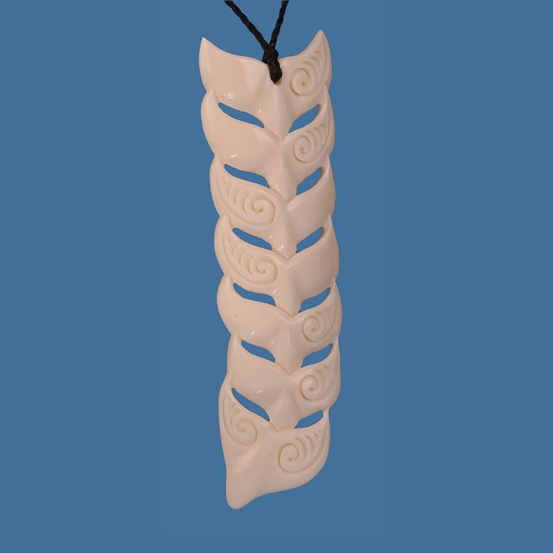 XL Bone Whale Tail pendant, 40mm wide and 135mm high, showcasing intricate Maori craftsmanship on an adjustable braided cord.