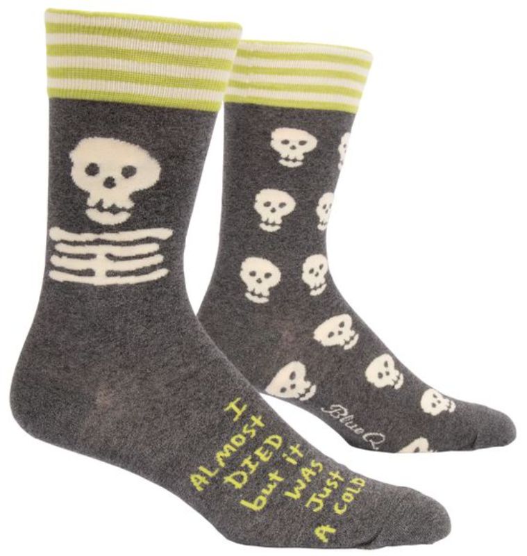 Quirky blue men's socks with "I Almost Died" text, comfy blend of cotton and nylon, perfect for any adventurous wardrobe.