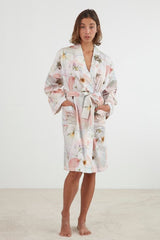 Lightweight blush pink kimono robe with pressed flower design, pockets, and waist tie, made from 100% cotton sateen.