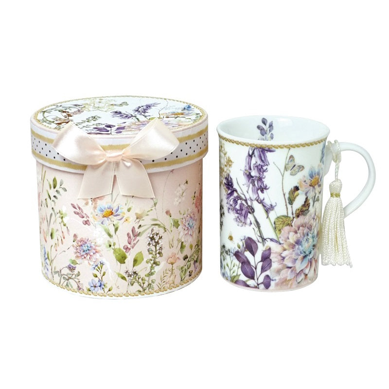Colorful floral ceramic mug in elegant gift box, perfect for tea lovers and cozy moments at home or office.