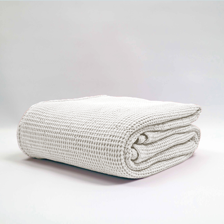 Large silver stonewashed blanket by Baksana, featuring a deep waffle texture, made from 100% certified cotton.