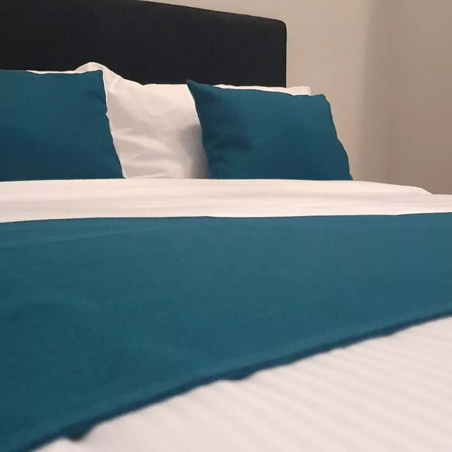 Vibrant teal King Single bed runner, crafted from 100% polyester, enhancing decor with style and comfort.