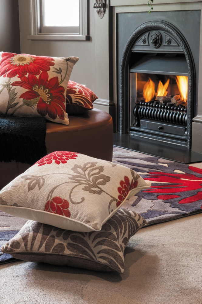 Red cushion featuring a floral design, perfect for adding comfort and style to any space, measuring 45x45cm.