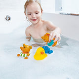 Wind-up teddy bear bath toy glides through water, designed for toddlers to enhance fun and fine motor skills during baths.