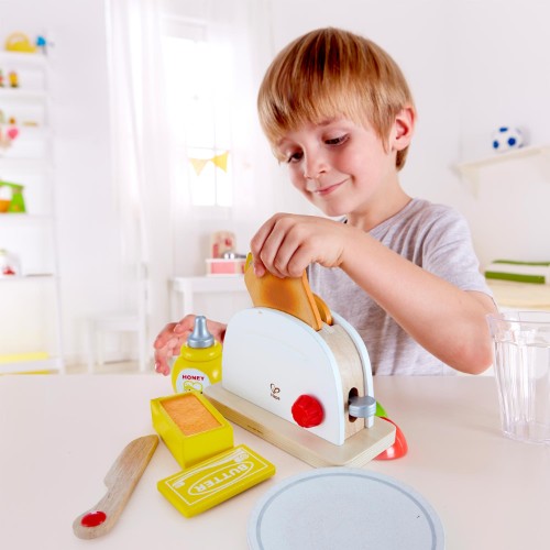 Colorful wooden Pop-Up Toaster Set for kids featuring toast, butter, and a serving plate for imaginative breakfast play.