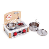 Realistic Hape 2-in-1 Kitchen & Grill Set with metal accessories, turnable knobs, and adjustable clock for role-play cooking fun.