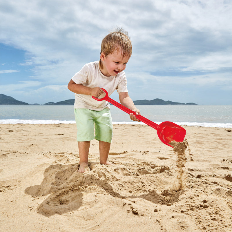 Vibrant red Hape Sand Shovel for kids, perfect for outdoor play, digging, and building sandcastles. Ideal for ages 18 months and up.