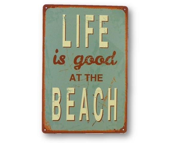 Retro beach-themed tin sign featuring whimsical artwork, perfect for coastal decor in beach houses or baches.