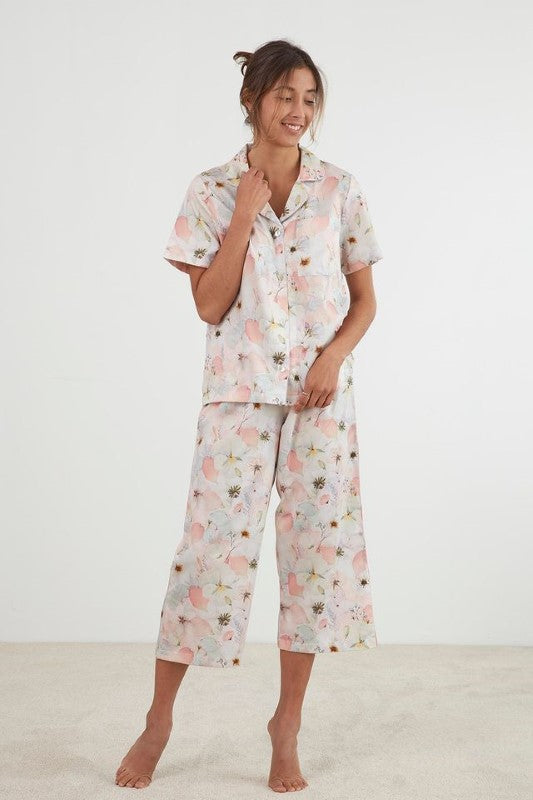 Blush pink capri PJ set with pressed flower design, featuring a button-up top and elasticated pants, made from cotton sateen.