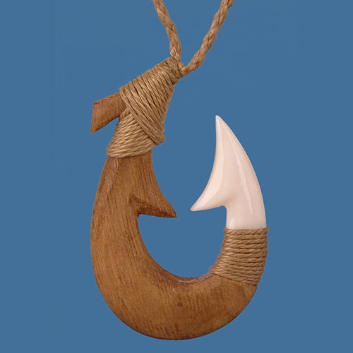 Hand-carved Wood & Bone Hook Pendant on adjustable cord, symbolizing good fortune and safe travels; unique craftsmanship.