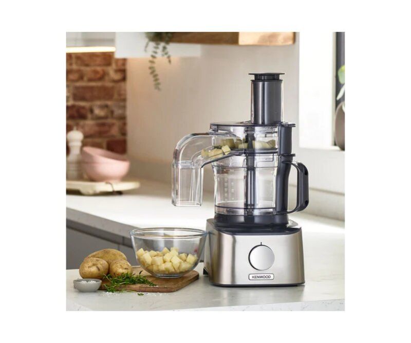 Brushed metal food processor with 800W motor, versatile attachments for chopping, grating, and blending, saving time and space.