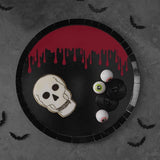 Fright Night paper plates with blood splatter design, ideal for Halloween parties and serving festive treats.