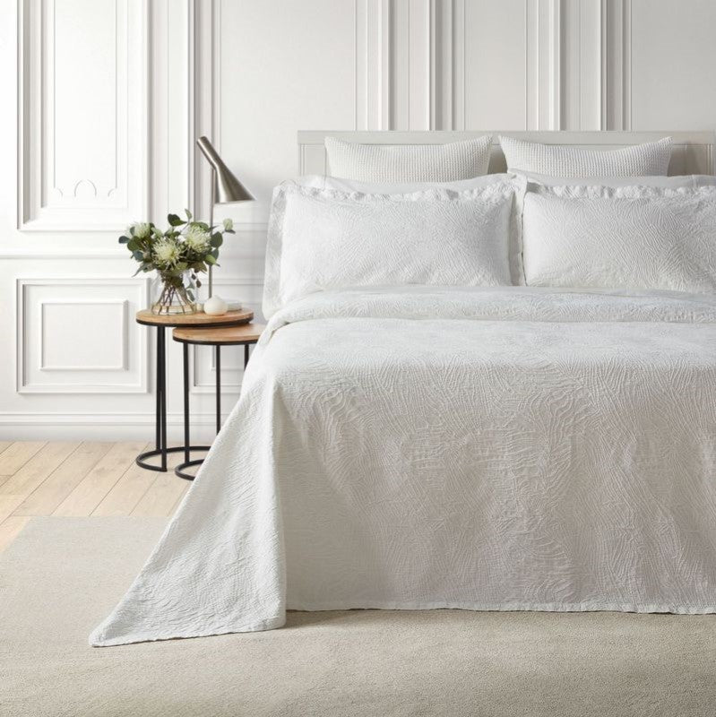 Elegant white Dunes bedspread with sand dune texture, made from OEKO-TEX® certified cotton for a serene bedroom ambiance.