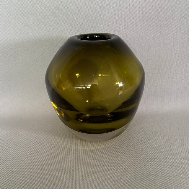 Elegant green vase measuring 14 x 15cm, perfect for fresh flowers or as a stylish decor accent.