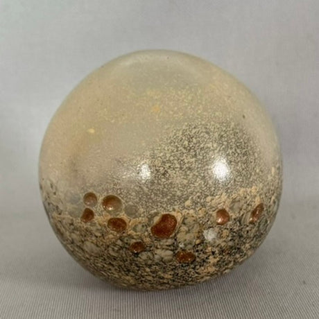 Elegant 10cm Neutral decorative orb enhancing decor as a stylish centerpiece or shelf accent in various home styles.