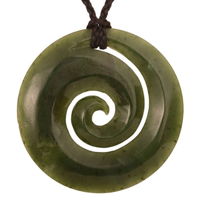 Elegant greenstone Koru pendant in Nephrite Jade, symbolizing new beginnings, on adjustable black wax cord.