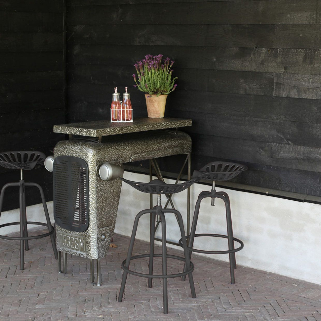 Grey Tractor Bar Stool with vintage tractor design, height adjustable, padded seat, and footrest for comfort.