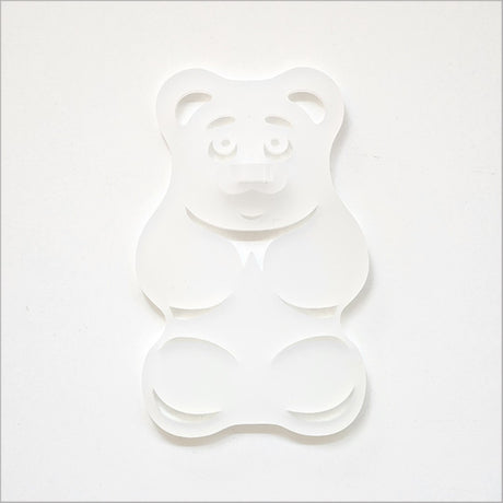 A white satin acrylic gummy bear art piece, 88mm x 139mm, playful and durable, ideal for modern decor.