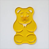 Yellow satin acrylic gummy bear sculpture, 88mm x 139mm, perfect for colorful home decor and moisture-resistant areas.