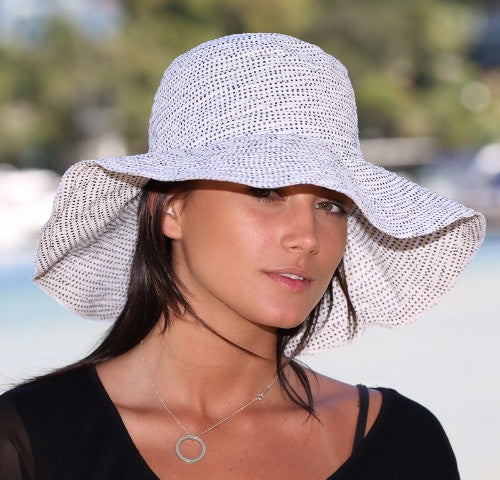 Stylish white sun hat offering UPF 50+, packable design, size-adjustable, and a wire brim for optimal shade coverage.