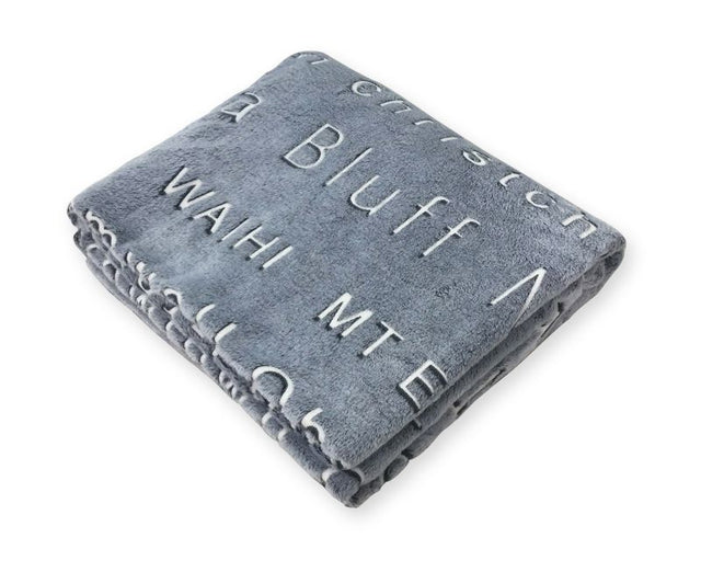 Cozy throw featuring New Zealand town names, measuring 152cm, perfect for warmth and stylish decor.