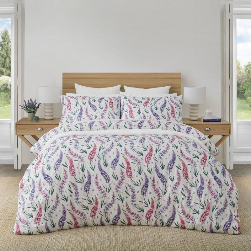 Floral king duvet cover set featuring pink and purple lupine on white, made from 100% OEKO-TEX® cotton, ethically produced.