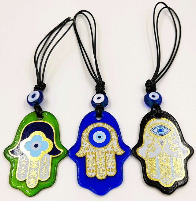 Handcrafted Turkish glass Hamsa wall hangings with evil eye motifs in assorted designs and colors, symbolizing protection and luck.