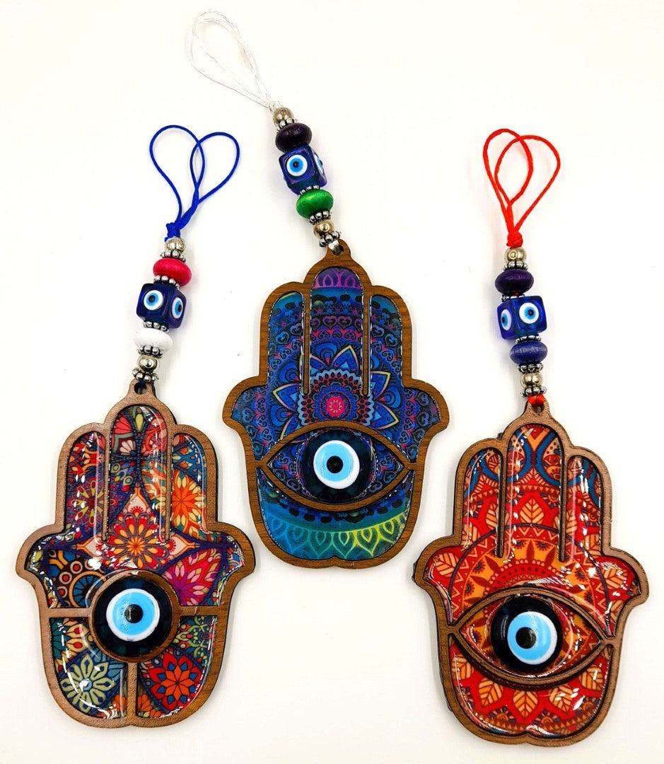 Set of 3 assorted Boho Hamsa Hand wall hangings with glass evil eyes, featuring vibrant colors and unique designs.