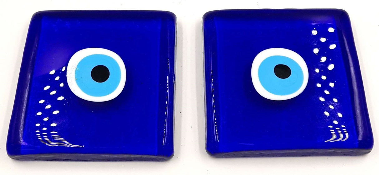 Set of 2 glass blocks with an evil eye design, symbolizing protection, perfect for modern home decor accents.