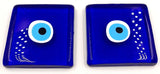 Set of 2 glass blocks with an evil eye design, symbolizing protection, perfect for modern home decor accents.