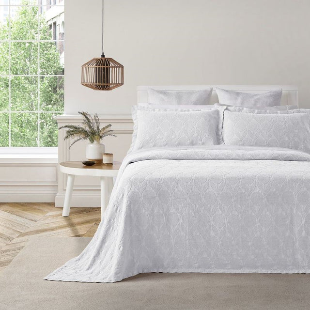 White Citron Bedspread by BAKSANA, featuring a floral matelassé design, includes two Oxford pillowcases and is ethically made in Portugal.