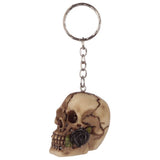 Set of 24 assorted resin and metal keyrings featuring intricate skull designs with detailed roses, ideal for edgy accessories.