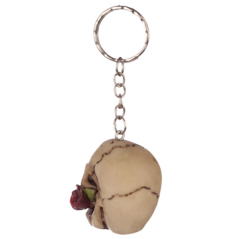 Assorted keyrings featuring intricate skull designs and roses, perfect for edgy keychains and gothic fashion lovers.