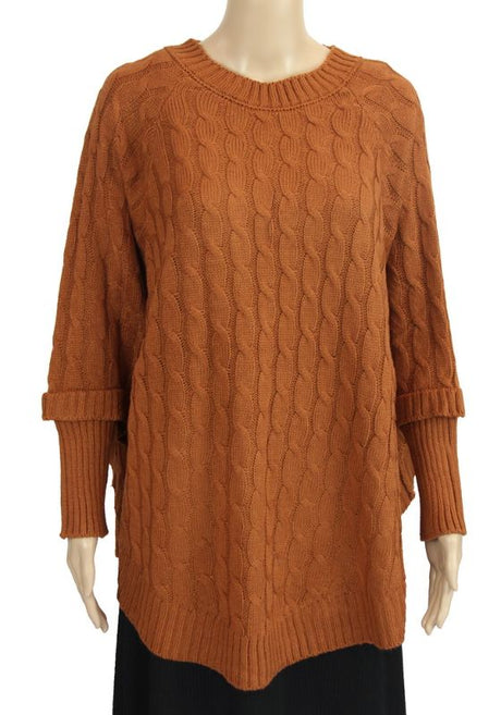 Rust cable knit poncho top in a relaxed fit, perfect for layering and providing style and warmth in cooler weather.