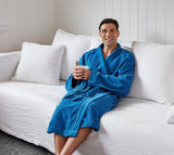 Kimono-style blue bathrobe with pockets, waist tie, and soft OEKO-TEX® certified cotton blend by BAKSANA.