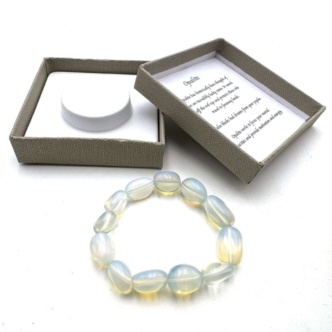 Large beaded bracelet with luminescent Opalite beads, perfect for adding elegance and tranquility to any outfit.