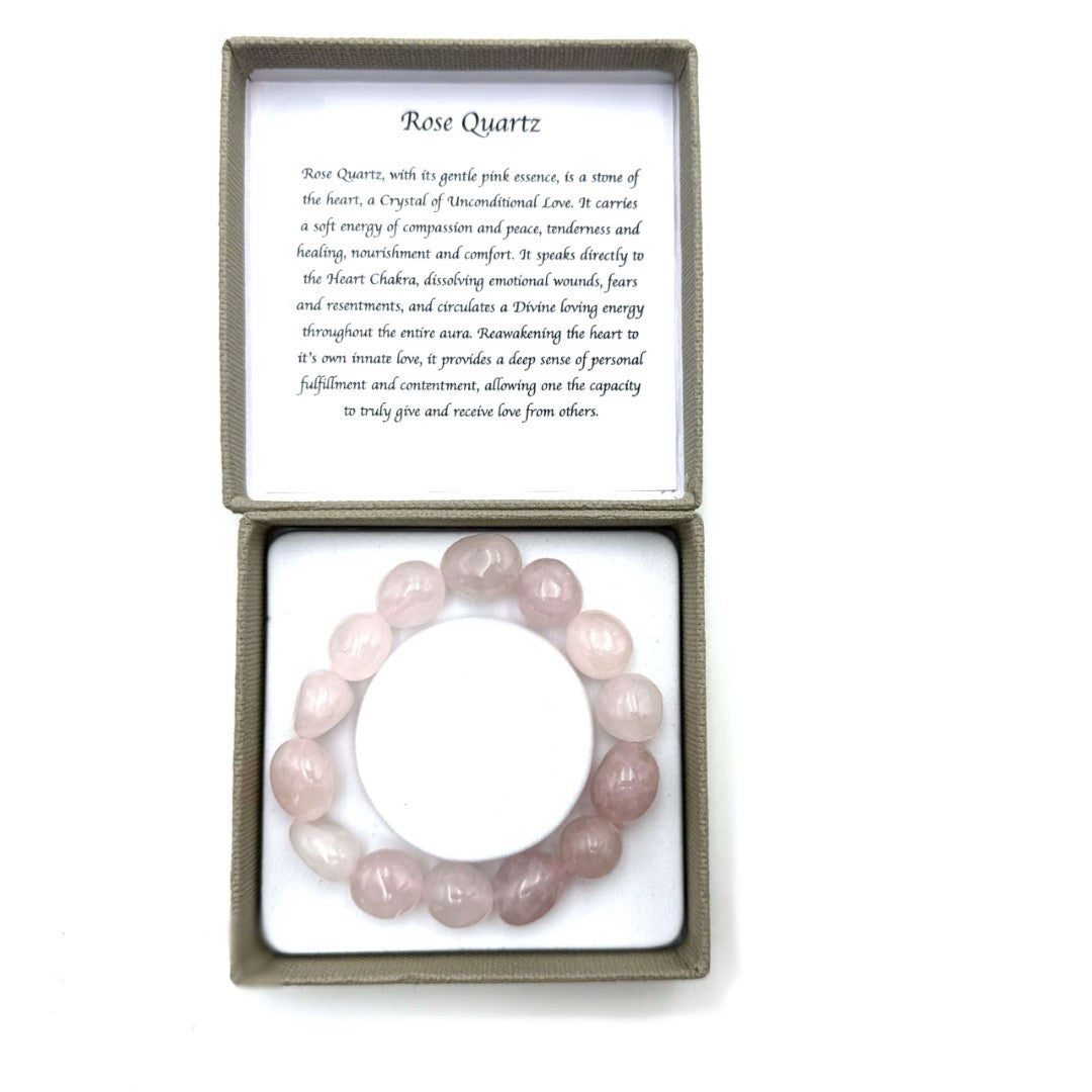 Large beaded bracelet made of smooth 14x11mm rose quartz, known for its healing properties and elegant pink hue.