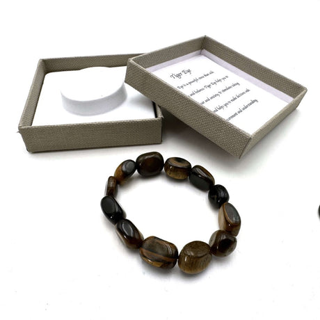 Large beaded bracelet made of genuine Tiger Eye, featuring bold golden brown and amber beads, promoting confidence and balance.