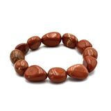 Large beaded bracelet made of vibrant Red Jasper gemstones, each 14 x 11mm, promoting emotional balance and creativity.