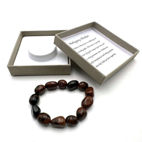 Large beaded bracelet made of polished mahogany obsidian, featuring 14x11mm beads for style and emotional healing.