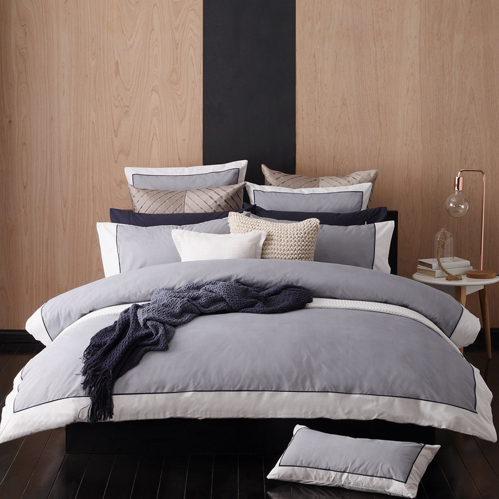 Super King Duvet Cover Set in Essex Navy with herringbone pattern, white border, and two pillowcases for a stylish bedroom.