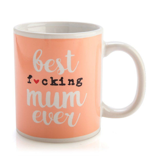 Ceramic mug with peachy-coral design, featuring the phrase "Best f*cking mum ever" for bold mothers, dishwasher safe.