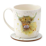 Porcelain mug with Highland cow design and cork coaster, perfect for tea or coffee, microwave and dishwasher safe.