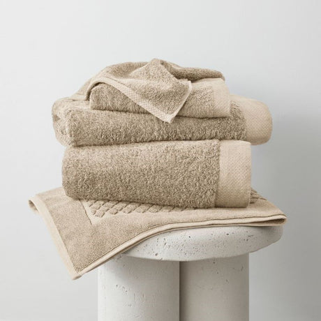 Eco-friendly bamboo bath mat in sand color, measuring 51 x 76 cm, designed for superior absorbency and softness.