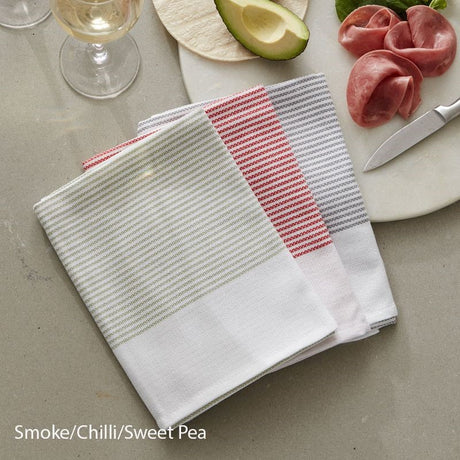 Absorbent and lint-free 100% cotton tea towel set in Smoke, Chilli, and Sweet Pea colors, designed in New Zealand by BAKSANA.