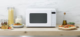 Panasonic NN-ST34NWQPQ Microwave Oven in white, featuring 25L capacity, 900W power, and 8 auto menus for easy cooking.