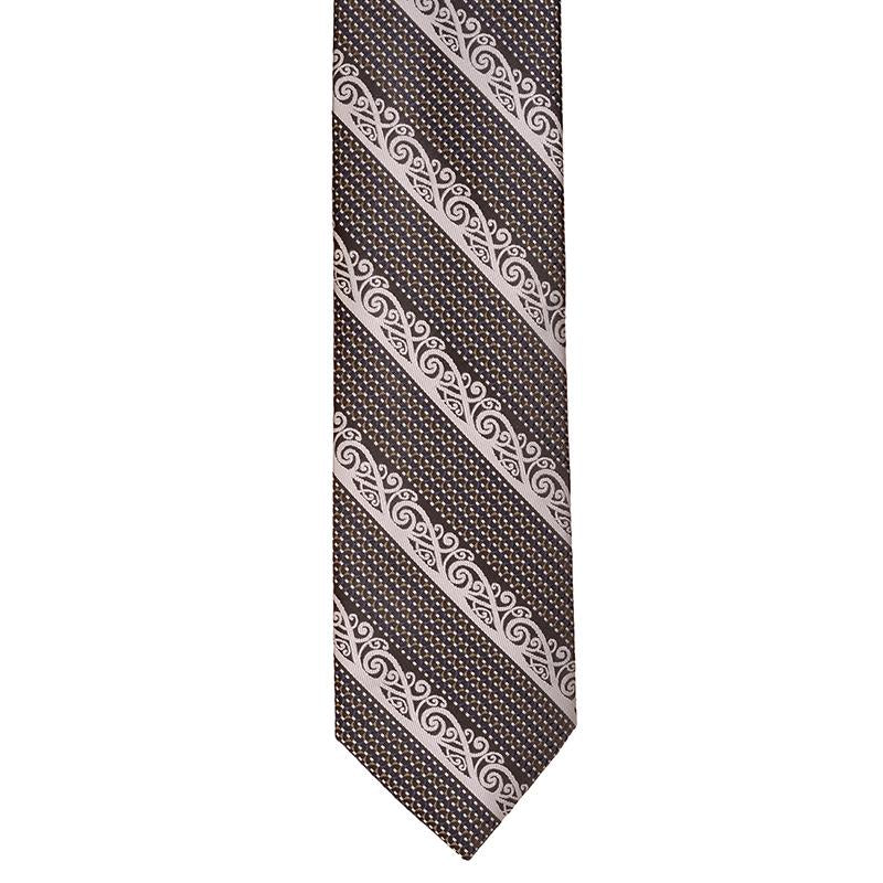 Maori Design Neck Tie featuring a silver Kowhaiwhai pattern on grey, navy blue, and silver, perfect for any formal or casual occasion.