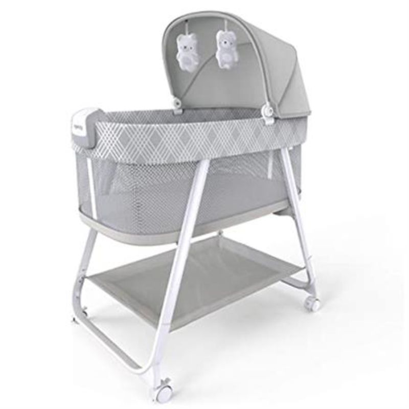 Soothing bassinet with mesh sides, night light, adjustable canopy, and plush toys for a restful sleep.